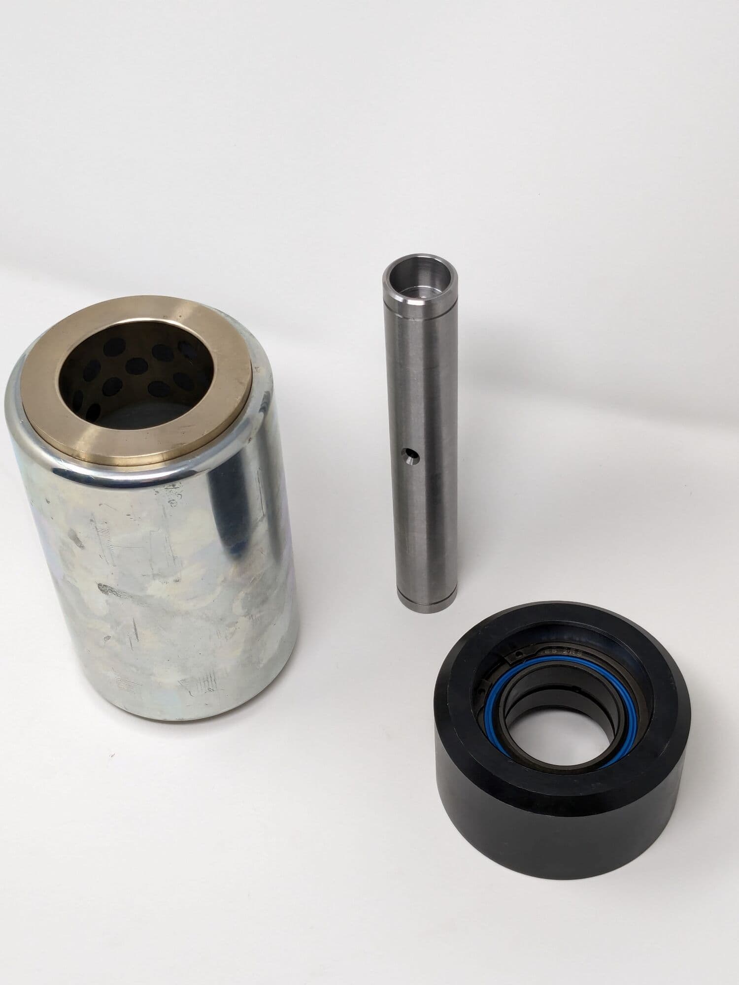 Machined bushes for earth moving equipment